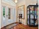 Bright entryway with hardwood floors, a large door, and decorative accents at 2075 Country Farms Rd, Port Orange, FL 32128