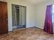 Bedroom with window, closet, and patterned curtains at 401 Cherry St, South Daytona, FL 32119
