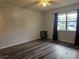 Bedroom with wood-look floors at 401 Cherry St, South Daytona, FL 32119