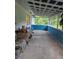 Screened porch with concrete flooring at 401 Cherry St, South Daytona, FL 32119