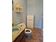 Small bathroom with blue toilet and vanity, and tiled floor at 401 Cherry St, South Daytona, FL 32119