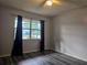 Bedroom with wood-look floors at 401 Cherry St, South Daytona, FL 32119