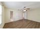 Bedroom with wood-look floors and ensuite bathroom at 1106 Carvello Dr, The Villages, FL 32162