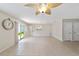 Bright living room with tile floors and access to backyard at 1106 Carvello Dr, The Villages, FL 32162