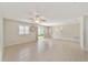 Spacious living room with tile floors and access to backyard at 1106 Carvello Dr, The Villages, FL 32162