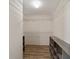 Large walk-in closet with wire shelving and additional storage at 1106 Carvello Dr, The Villages, FL 32162