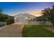 White single story home with attached garage, and white picket fence at 1106 Carvello Dr, The Villages, FL 32162