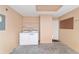 Laundry room with washer, dryer, and extra shelving at 1106 Carvello Dr, The Villages, FL 32162