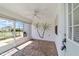 Bright and airy screened porch overlooking the backyard at 1106 Carvello Dr, The Villages, FL 32162