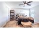 Cozy bedroom with a comfortable bed, ceiling fan, and built-in shelving at 3171 Utah Dr, Deltona, FL 32738