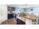 Spacious kitchen with granite countertops, dark cabinets, and stainless steel appliances at 3171 Utah Dr, Deltona, FL 32738