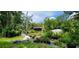 Ranch style home with screened porch and lush landscaping at 711 Sunset Ave, Orange City, FL 32763