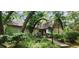 Charming house nestled amongst lush greenery, offering curb appeal at 711 Sunset Ave, Orange City, FL 32763