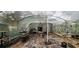 Interior of a greenhouse with potting supplies at 711 Sunset Ave, Orange City, FL 32763