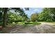 Long driveway leading to a property in a wooded area at 711 Sunset Ave, Orange City, FL 32763