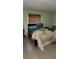 Bedroom with double bed, window coverings and nightstand at 711 Sunset Ave, Orange City, FL 32763