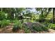Landscaped backyard with purple plants at 711 Sunset Ave, Orange City, FL 32763