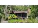 Rustic home with stone fireplace and large screened porch at 711 Sunset Ave, Orange City, FL 32763