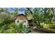 Two story home with barn style roof and screened porch at 711 Sunset Ave, Orange City, FL 32763