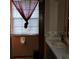 Bathroom with double vanity and window at 711 Sunset Ave, Orange City, FL 32763