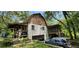 View of the home's exterior, including garage and landscaping at 711 Sunset Ave, Orange City, FL 32763