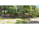 Ranch-style home with mature trees and a spacious yard at 711 Sunset Ave, Orange City, FL 32763