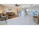 Bright living room with open kitchen and tile floors at 4435 S Atlantic Ave # 414, Ponce Inlet, FL 32127