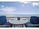 Oceanfront balcony with table and chairs at 4435 S Atlantic Ave # 414, Ponce Inlet, FL 32127