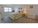 Cozy bedroom with a white bed frame and tropical bedding at 4435 S Atlantic Ave # 414, Ponce Inlet, FL 32127