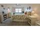 Spacious bedroom with a white dresser and tropical bedding at 4435 S Atlantic Ave # 414, Ponce Inlet, FL 32127