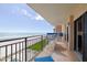 Spacious balcony overlooking the ocean with seating for four at 4435 S Atlantic Ave # 414, Ponce Inlet, FL 32127