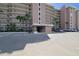 Sandcastle North building exterior with ample parking at 4435 S Atlantic Ave # 414, Ponce Inlet, FL 32127