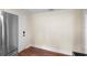 Kitchen features stainless steel refrigerator and wood flooring at 409 W Beresford Ave, Deland, FL 32720