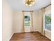 Bright bedroom with hardwood floors, ceiling fan, and large windows at 409 W Beresford Ave, Deland, FL 32720