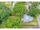 An aerial view of the property highlighting the house and surrounding lush greenery at 112 S Chandler Ave, Deland, FL 32724