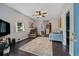 Living room featuring dark hardwood floors and comfy seating at 112 S Chandler Ave, Deland, FL 32724