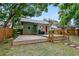Spacious deck overlooking a fenced backyard with a firepit at 112 S Chandler Ave, Deland, FL 32724