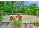 Relaxing community patio with picnic tables and Adirondack chairs at 600 N Boundary Ave # 101A, Deland, FL 32720