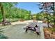 Community picnic area with multiple tables and chairs, surrounded by lush landscaping at 600 N Boundary Ave # 101A, Deland, FL 32720