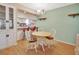 Dining area with wood table and chairs, adjacent to kitchen at 600 N Boundary Ave # 101A, Deland, FL 32720