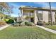 Exterior view of condo building with landscaping and walkway at 600 N Boundary Ave # 101A, Deland, FL 32720