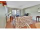 Living room with floral sofa and sliding glass door to patio at 600 N Boundary Ave # 101A, Deland, FL 32720
