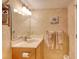 Bright bathroom featuring a vanity and shower at 1513 Ocean Shore Blvd # 3C, Ormond Beach, FL 32176