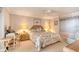 Bright bedroom with a king-size bed, desk, and ocean view at 1513 Ocean Shore Blvd # 3C, Ormond Beach, FL 32176