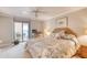 King bedroom with balcony access and a workspace at 1513 Ocean Shore Blvd # 3C, Ormond Beach, FL 32176