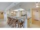 Kitchen with breakfast bar and wood cabinetry at 1513 Ocean Shore Blvd # 3C, Ormond Beach, FL 32176