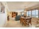 Bright dining area with ocean view and wood table at 1513 Ocean Shore Blvd # 3C, Ormond Beach, FL 32176