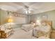 Guest bedroom with two twin beds and ceiling fan at 1513 Ocean Shore Blvd # 3C, Ormond Beach, FL 32176
