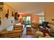 Living area with bamboo furniture, wood floors, and access to balcony at 1401 S Palmetto Ave # 402, Daytona Beach, FL 32114