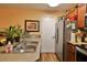 Bright kitchen with double sink and stainless steel appliances at 1401 S Palmetto Ave # 402, Daytona Beach, FL 32114